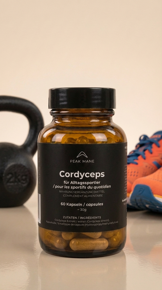 Bottle of Peak Mane Cordyceps supplement with a kettlebell and sports shoes in the background